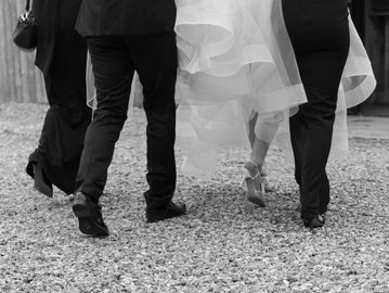 People walking, possibly at a wedding.