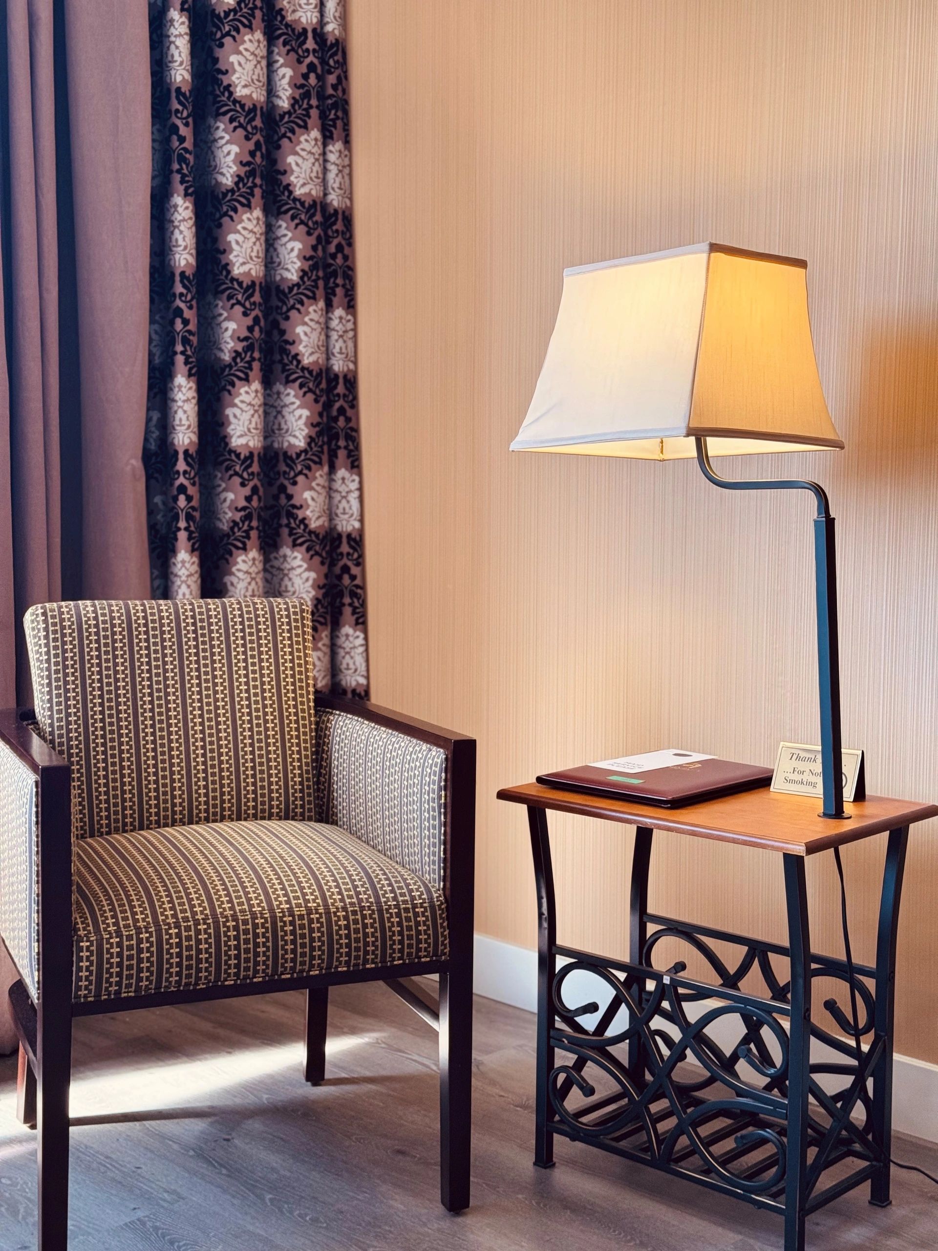 A chair and lamp in a room