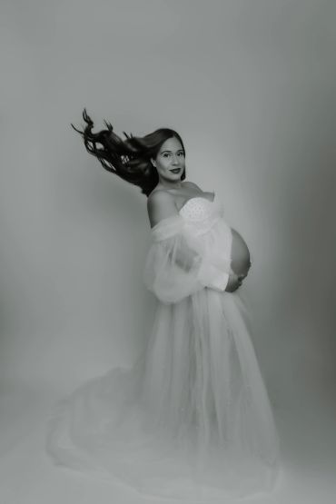Pregnant woman in flowing maternity gown dress with hair in motion. Taisha Marie Photos , Bronx, NY, New York City