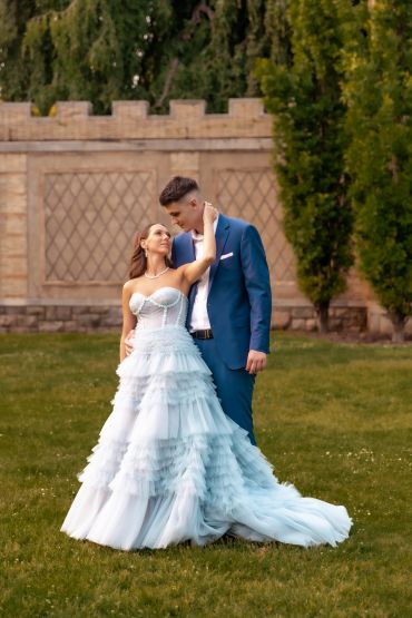 Engaged couple in elegant attire sharing a tender moment outdoors.Taisha Marie Photos , Bronx, NY, New York City