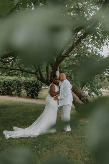 Bride and groom embracing under a tree. in Glen Island, New Rochelle, NY Taisha Marie Photos , Bronx, NY, New York City