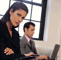 Two professionals working in an office.
