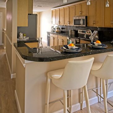 Beautiful design of a breakfast table along with kitchen