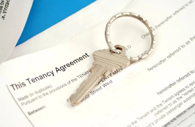 A key on a paper named “Tenancy Agreement”