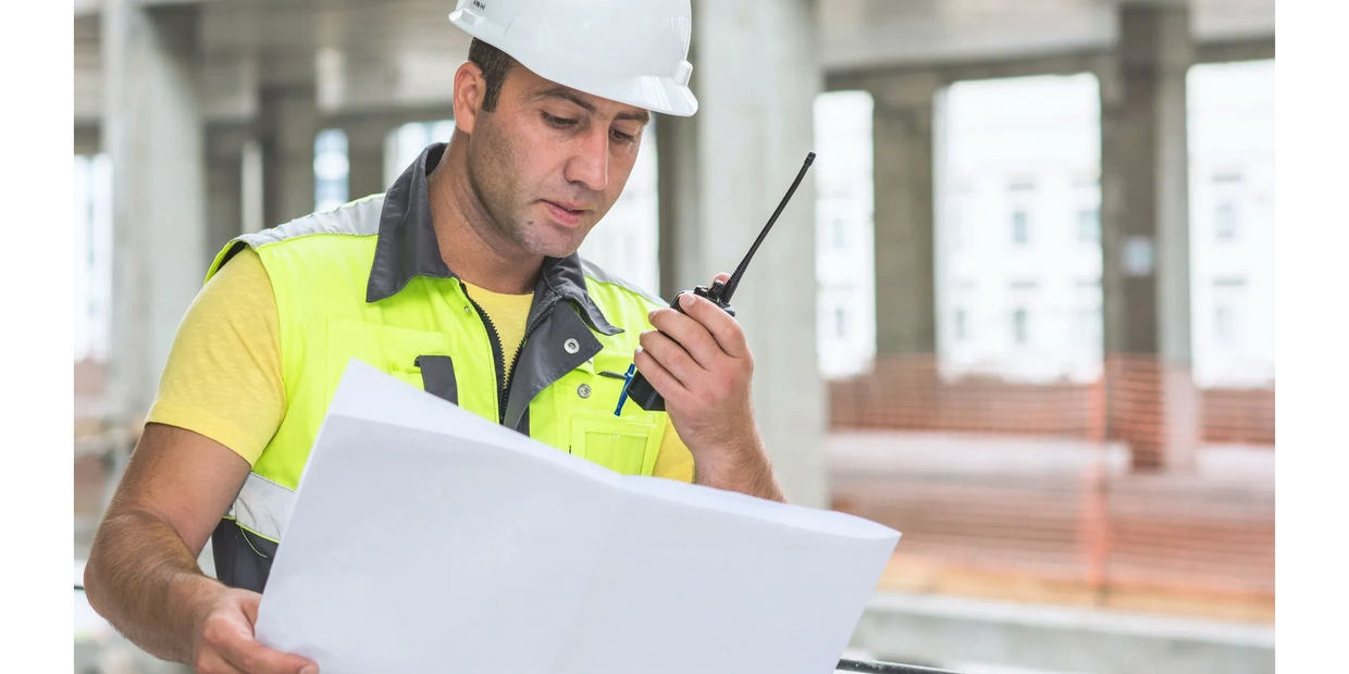 Professional contractors performing a residential roof installation on a house.