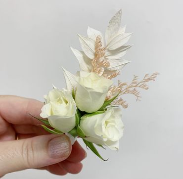 White rose buttonhole boutonniere
