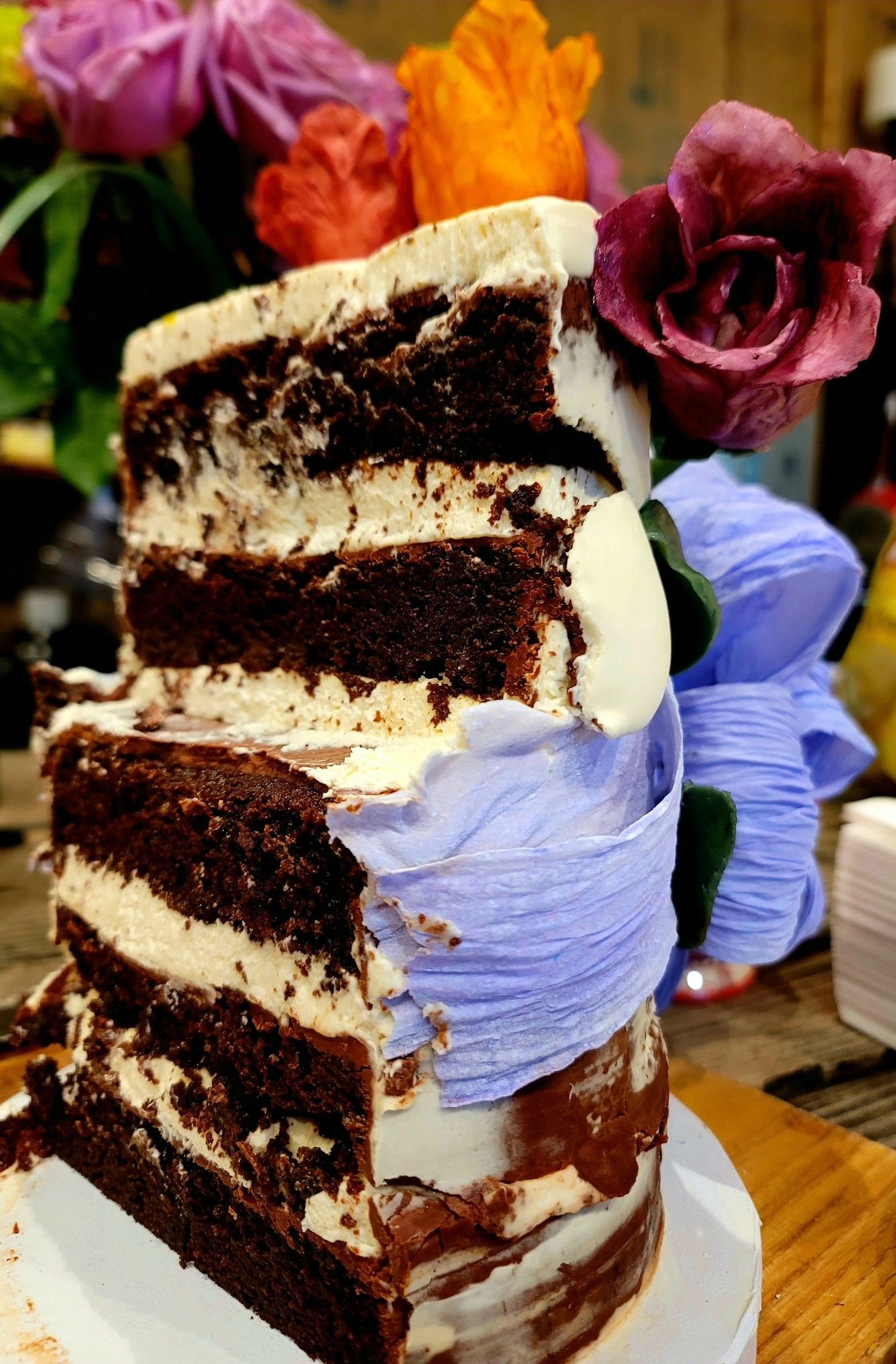 Edible Wafer Paper Bow, White Chocolate Hand-Painted Florals covering a Double-Chocolate Cake with a