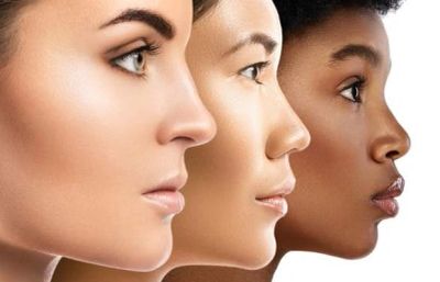 Three diverse women in profile view.