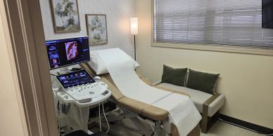 Ultrasound examination room with modern equipment.