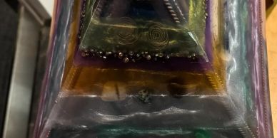 Close-up of an object with layered colorful materials.