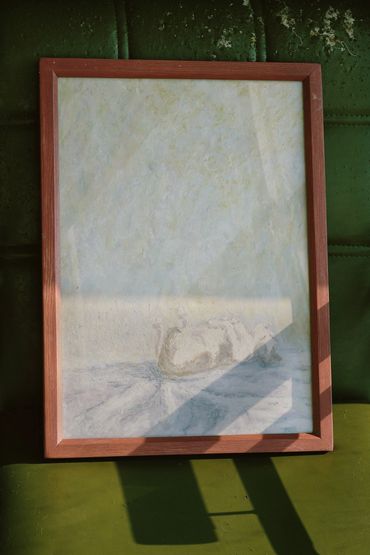 Framed artwork of a swan in a minimalistic style on a green background.