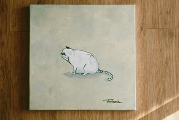Painting of a white mouse on a beige canvas with a wooden floor background.
