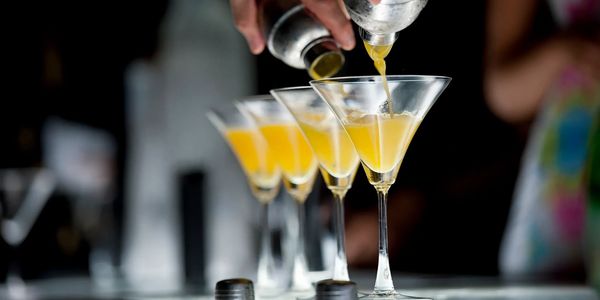 Bartender pouring cocktails