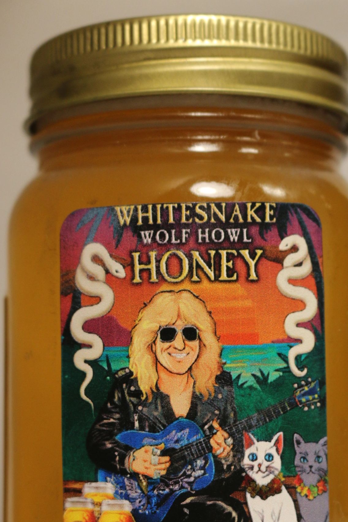 Jar of Whitesnake Wolf Howl Honey with colorful label art.