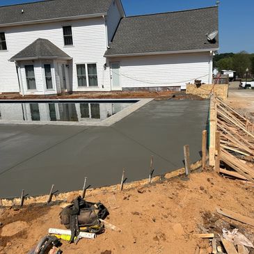 Pool deck with 4Ft turn down retaining wall.