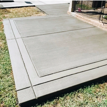 Patio and sidewalk addition behind house.