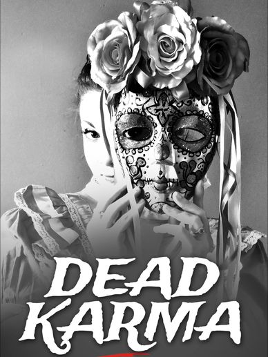 Black-and-white photo of a person in a decorative mask and vintage dress.