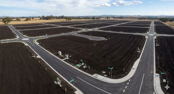 Newly paved roads and empty plots ready for development.