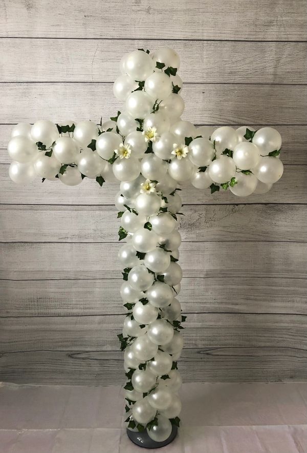 Pearlescent white balloon cross with flowers and greenery!