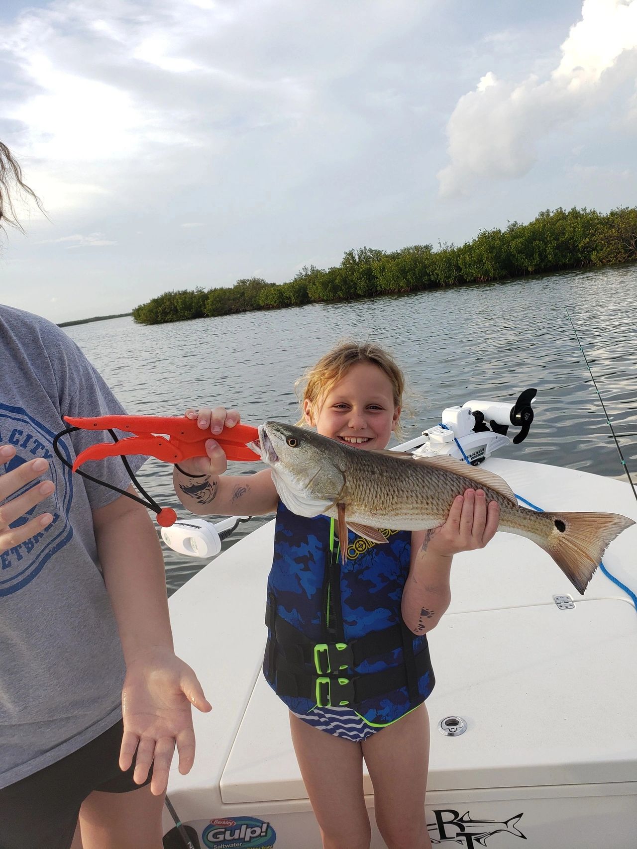 Client with a redfish caught while inshore fishing DAYTONA BEACH 