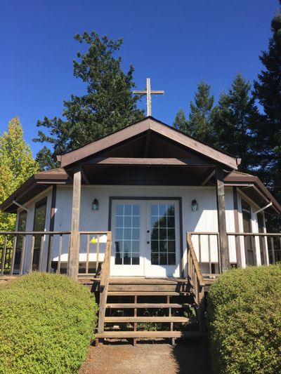 Starcross Chapel, white chapel with wooden cross on roof