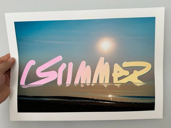 A photo of a sunset over water with the word 'summer' in colorful text.