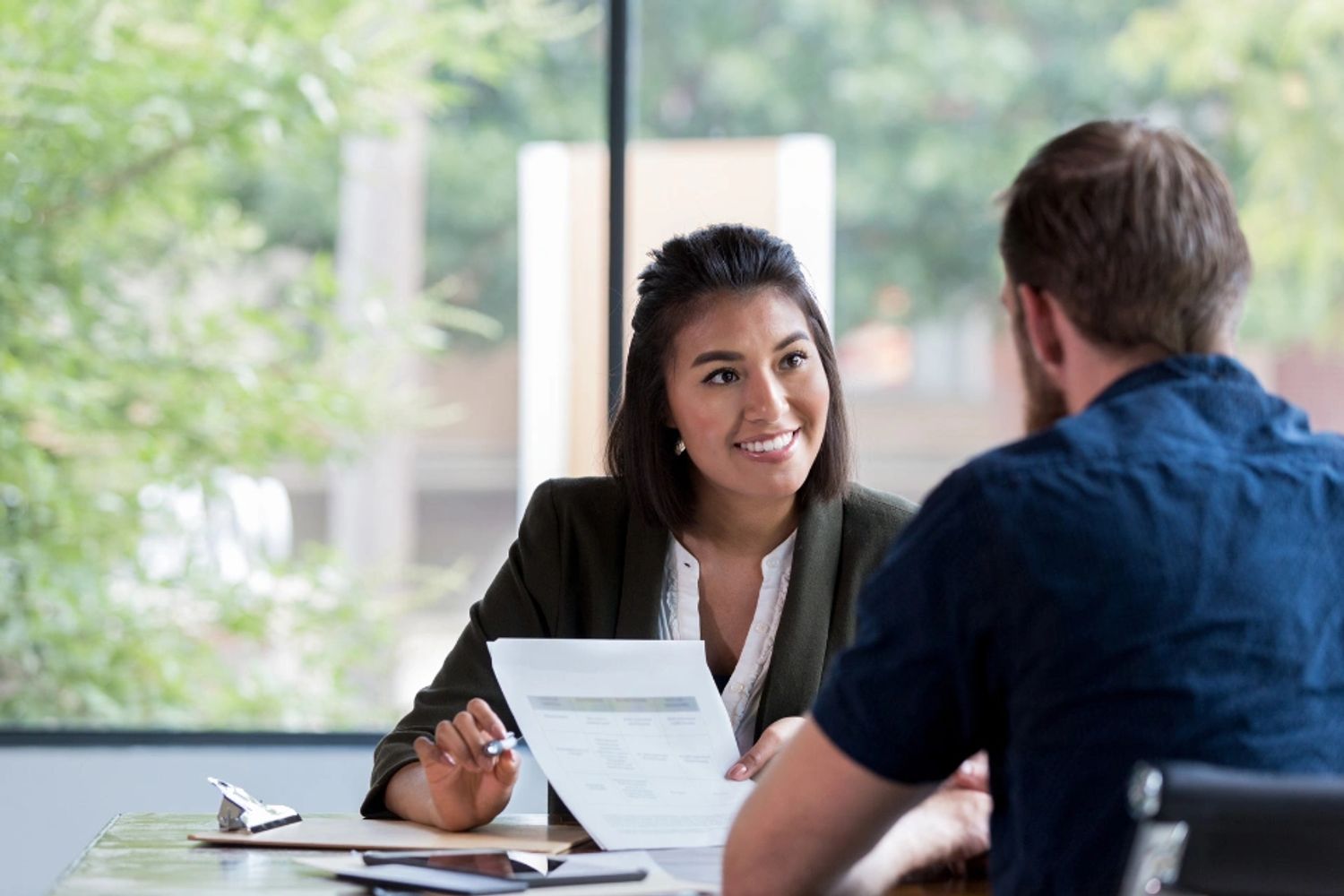 woman explaining insurance coverage to a man