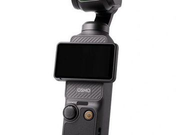 Compact handheld Osmo camera with a built-in screen and joystick control.