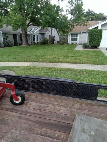 Well-maintained green lawn in a residential area.