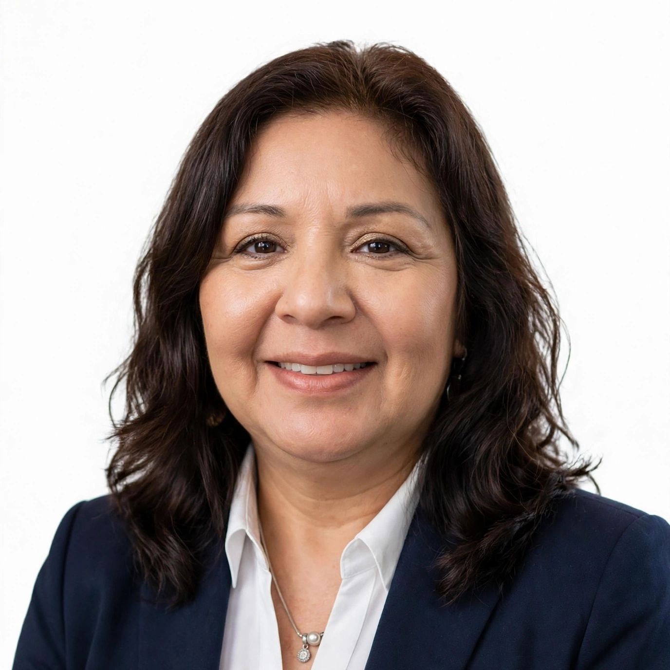Smiling middle-aged woman in business attire.