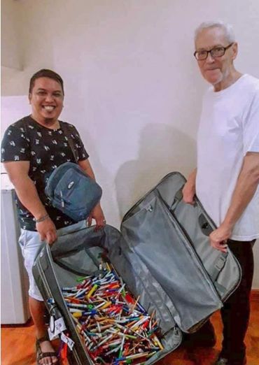 The Founder, William Monson, delivering school supplies for the poor.