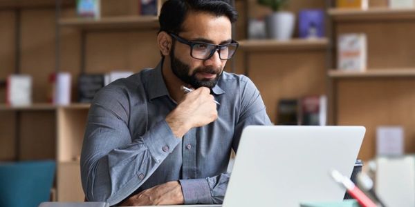 Man sitting at a laptop