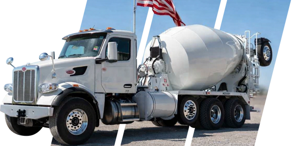 Peterbilt cement mixer truck with rotating drum parked under clear blue sky in USA
