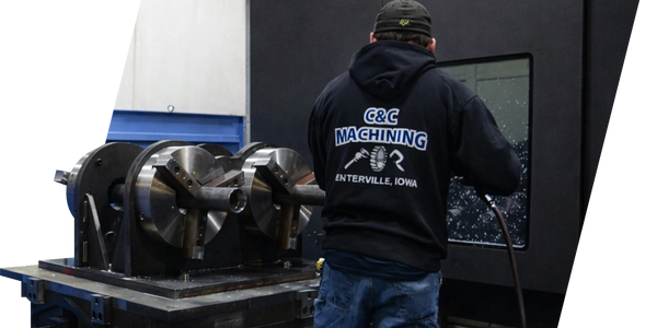 Operator running DOOSAN HM 1250 CNC machine at C&C Machining Enterville Iowa workshop.