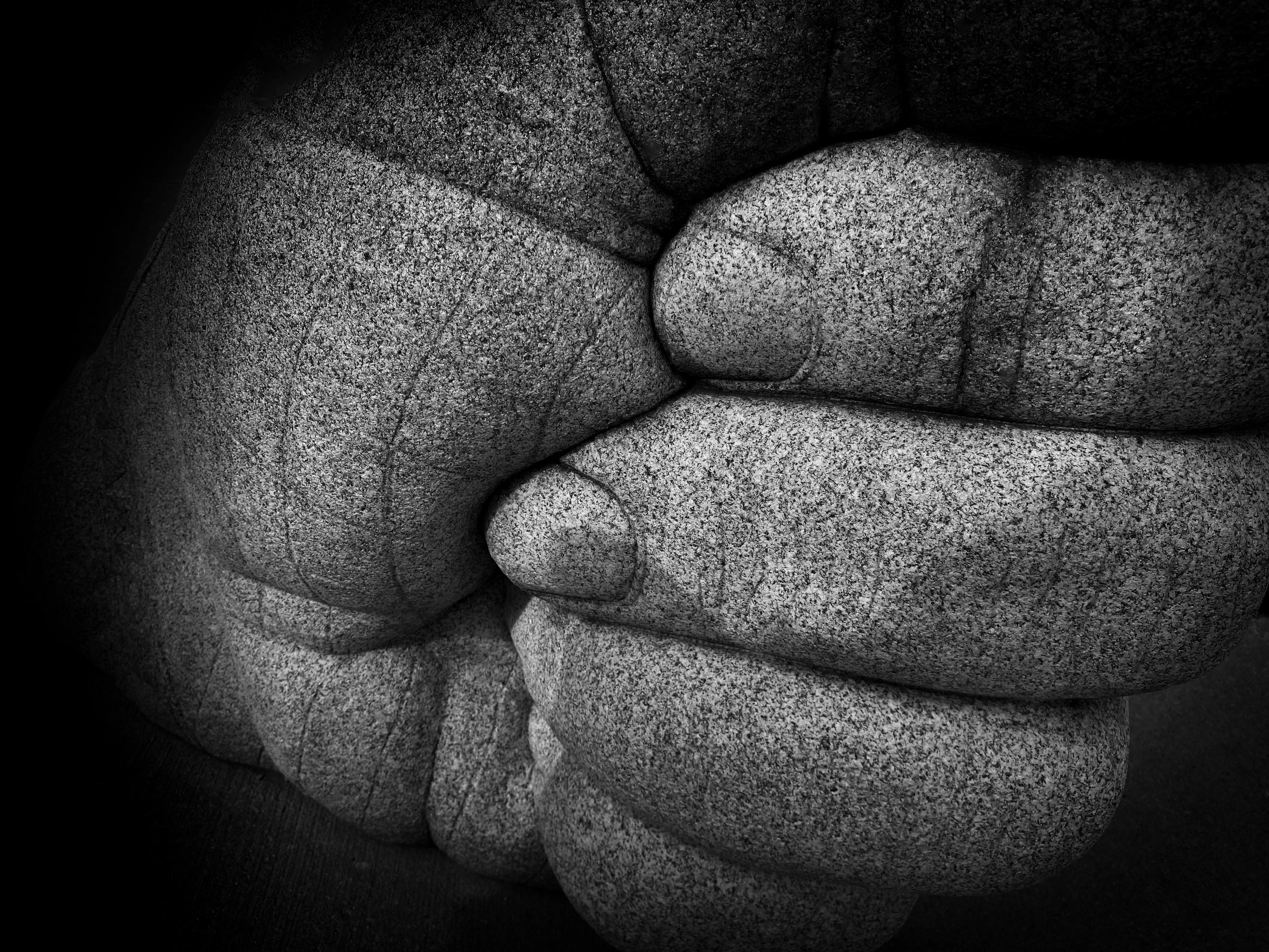 Abstract close-up of textured rock formations in black and white.