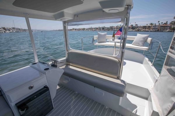 Seating area on a boat with ocean view.