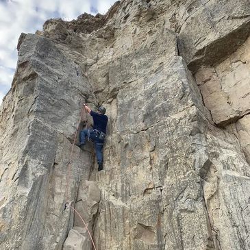 Josh Johnson lead climbing on limestone in Portland, Dorset, UK
