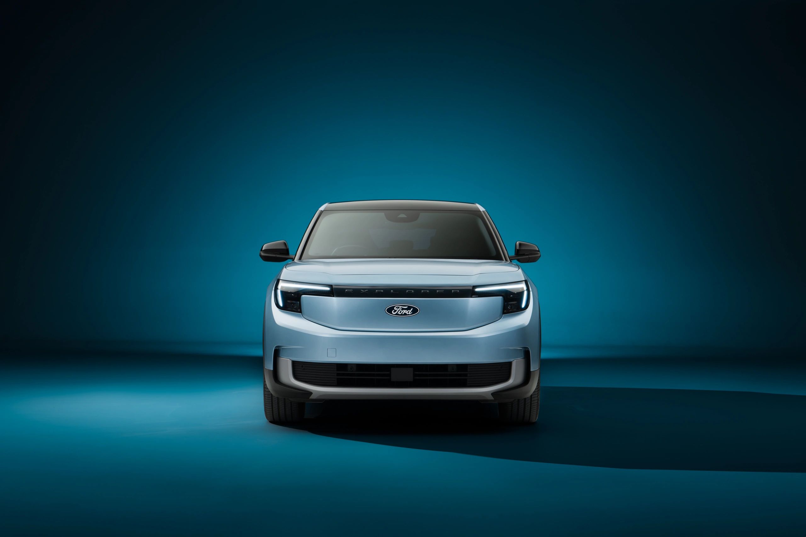 Front view of a light blue Ford electric SUV.