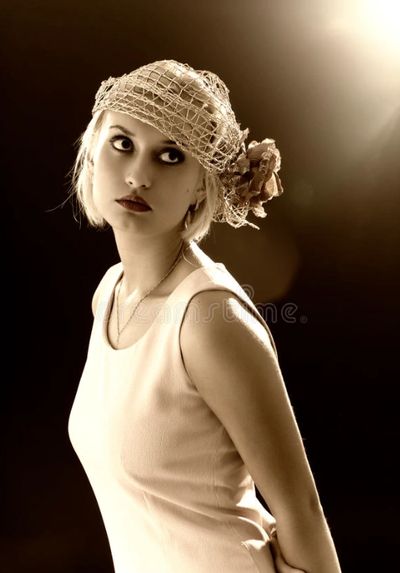 a woman in white dress is looking up