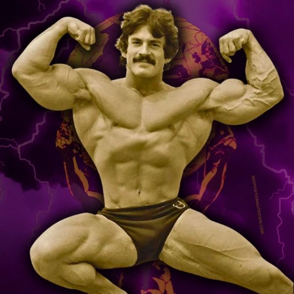Mike Mentzer flexing while striking a pose.