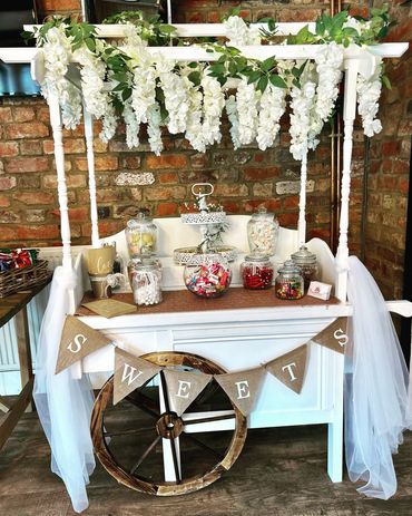 Rustic sweet cart set up. sweet pckages fully loaded sweets pick and mix sweets 