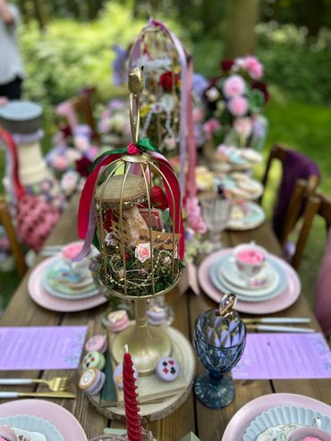 Alice in wonderland wedding. Birdcage centre pieces made bespoke table decor Disney woodland wedding