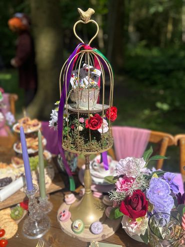 Birdcage flower centre prices, Alice in wonderland theme party. 