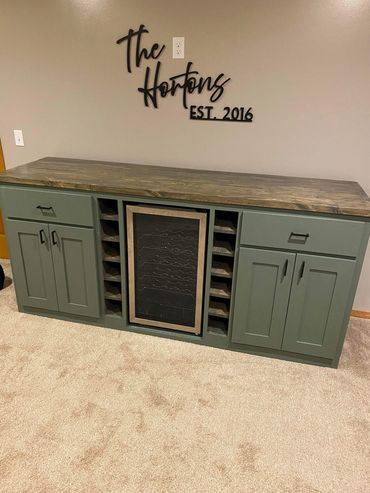 Custom designed green wine fridge bar.