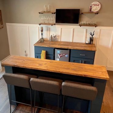 Custom built 2 piece navy blue basement bar.