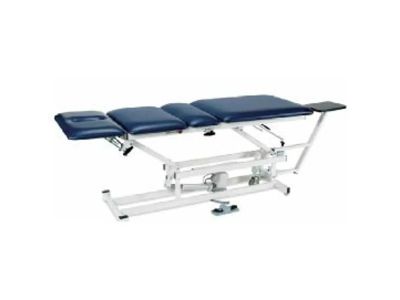 Adjustable medical examination table with padded sections.