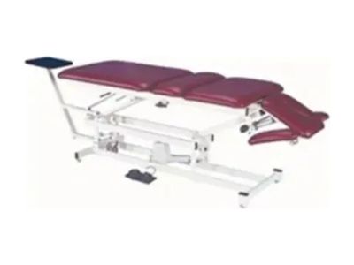Adjustable medical examination table with maroon cushions.