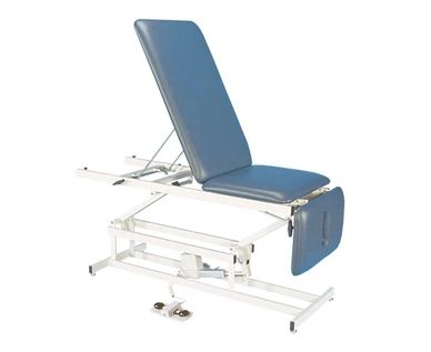 Adjustable medical examination table with blue padding.