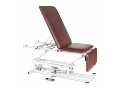 Adjustable medical examination table with burgundy cushion.