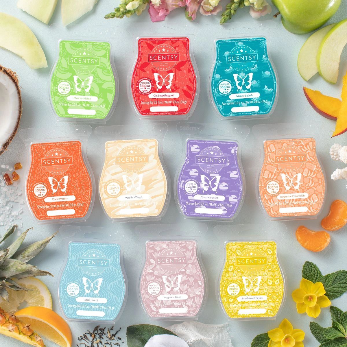 Scentsy wax bars with various fragrances surrounded by fruits and flowers.